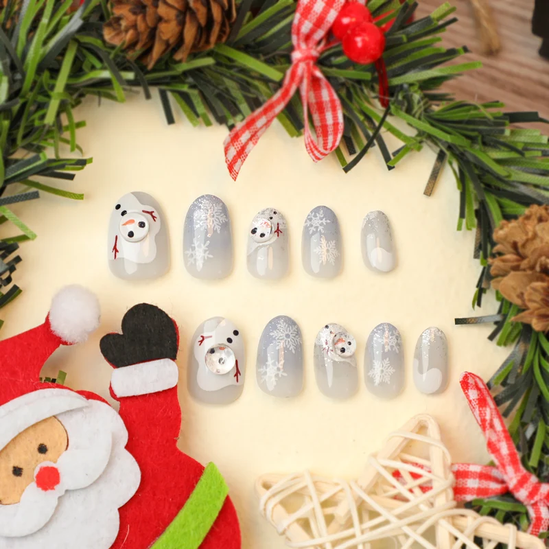 Kunstvolle Winter-Nagelverlängerungen mit Schneemann-Design Karnz