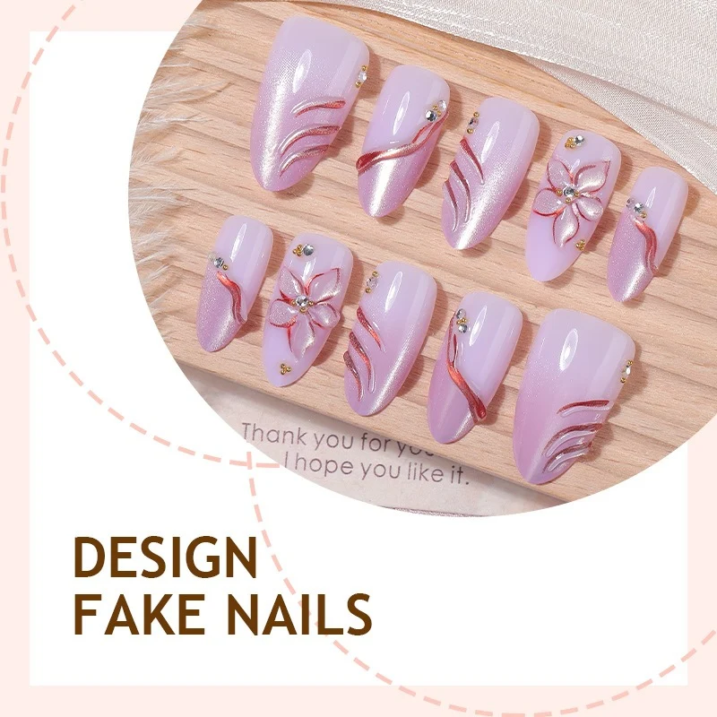 Kunstnagelset mit eleganten Blüten- und Glitzermotiven Karnz
