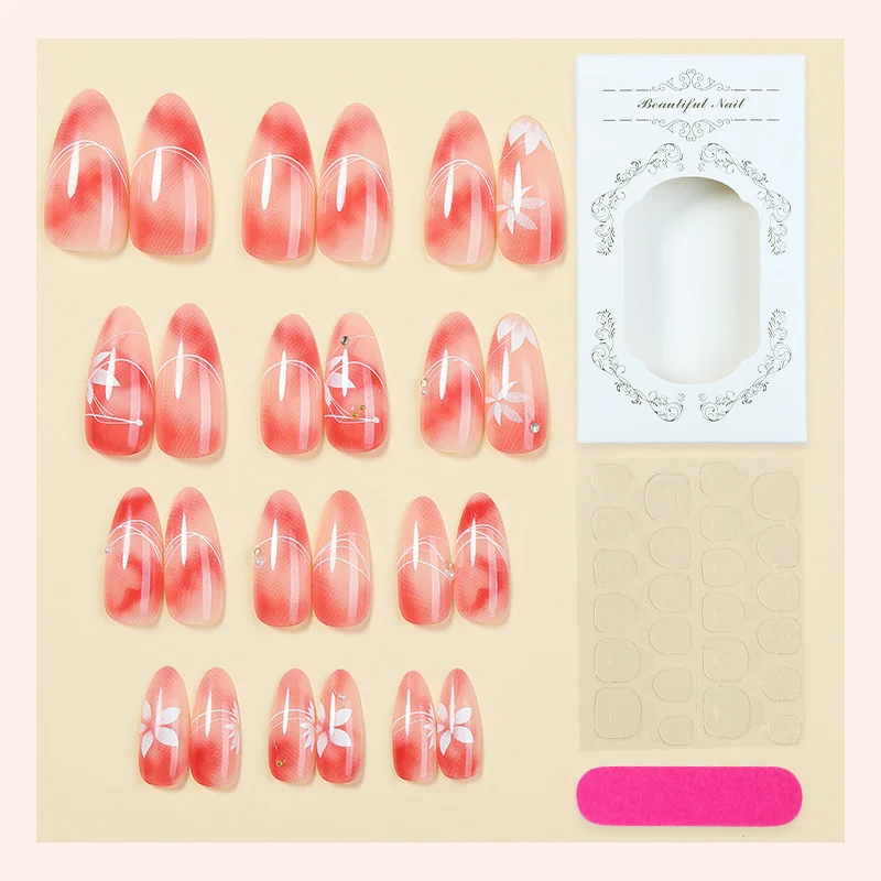 Kunstnagelset mit elegantem Ombre-Design und floralem Akzent Karnz