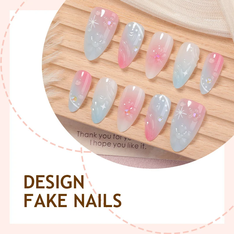 Kunstnagelset mit elegantem Ombre-Design und Blütenverzierungen Karnz