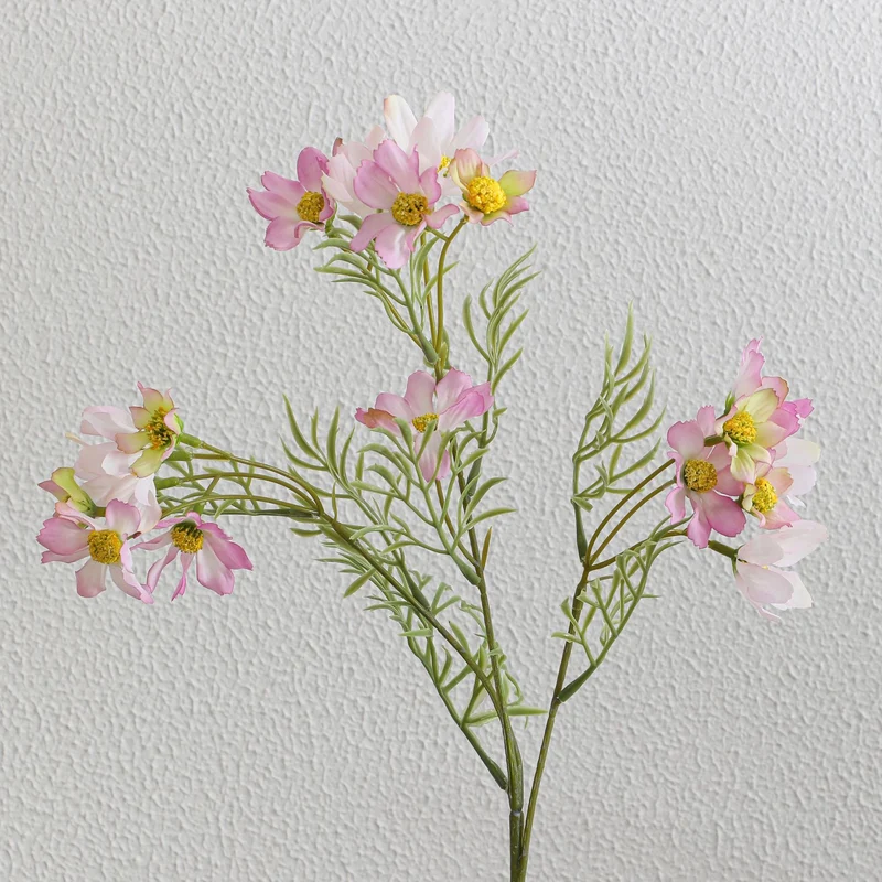Künstlicher Blütenzweig mit leuchtenden pinken Blumen Karnz