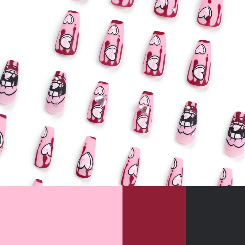 Kunstvolle Stiletto-Nägel mit Herzen und Glitzerakzenten Karnz