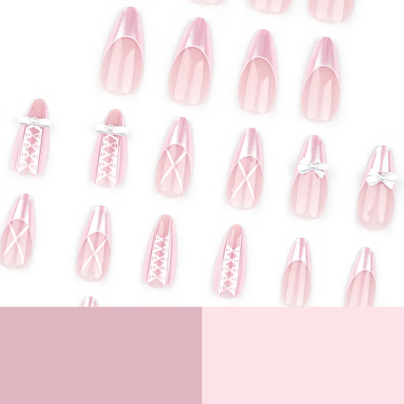 Kunstvolle Stiletto-Nägel mit eleganten Perlen- und Schleifenakzenten Karnz
