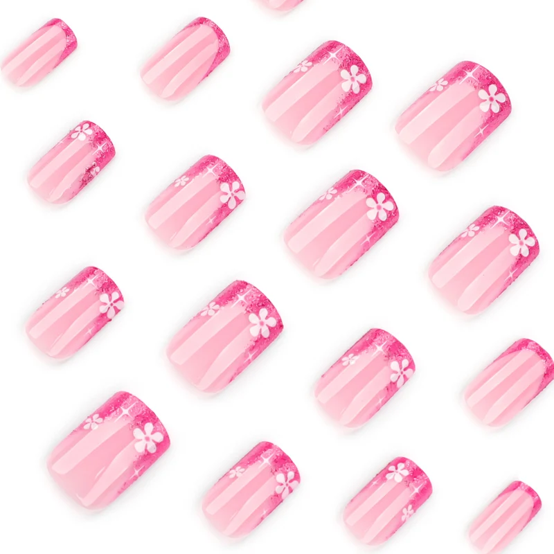 Kunstvolle Nagelkunst mit floralem Akzent und Glitzer Karnz