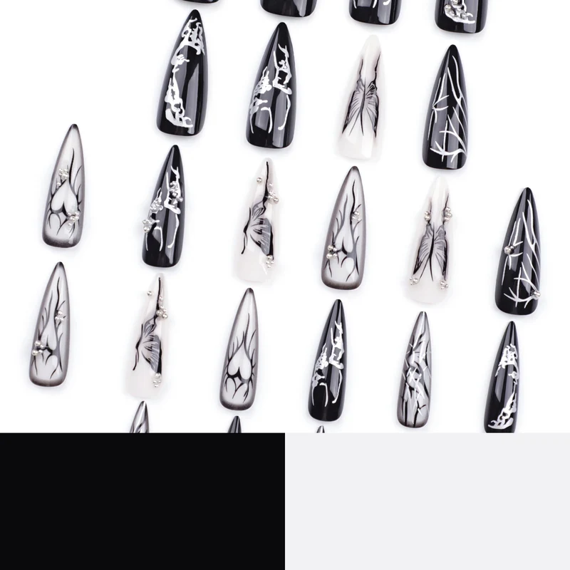 Kunstvolle Nagelkunst mit elegantem Schwarz-Weiß-Design Karnz