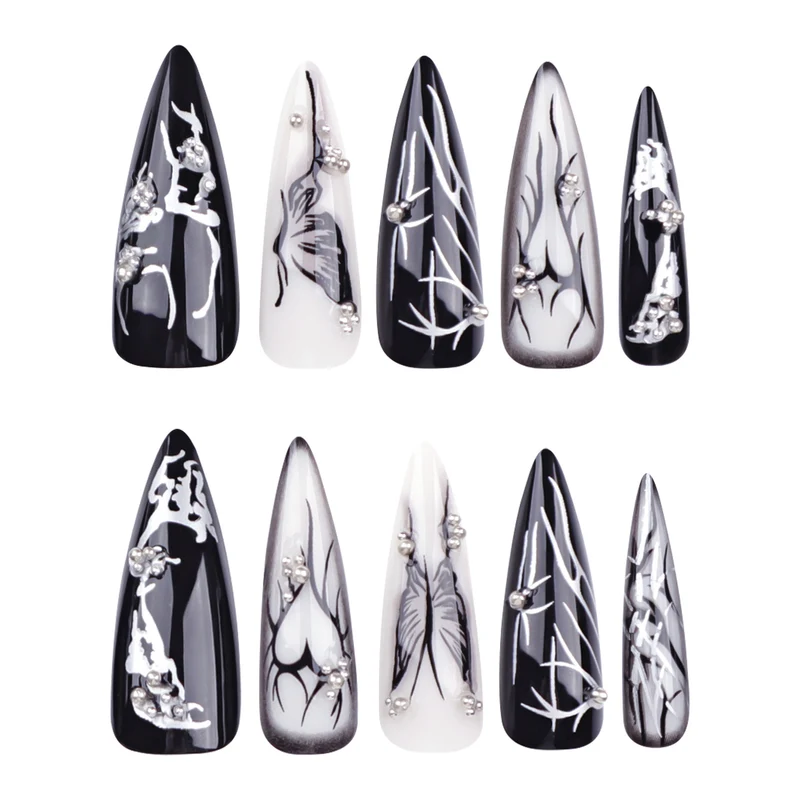 Kunstvolle Nagelkunst mit elegantem Schwarz-Weiß-Design Karnz