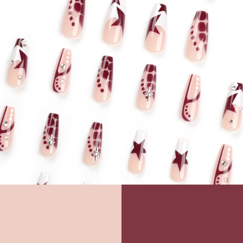 Kunstvolle Nagelverlängerungen mit Glitzer und Sternenmotiven Karnz