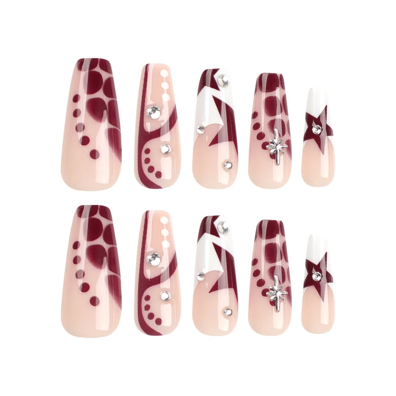 Kunstvolle Nagelverlängerungen mit Glitzer und Sternenmotiven Karnz