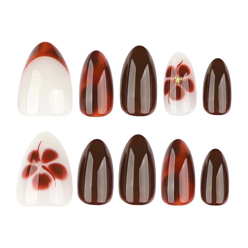Kunstvolle Nagelverlängerungen mit eleganten floralem und glanzvollem Design Karnz