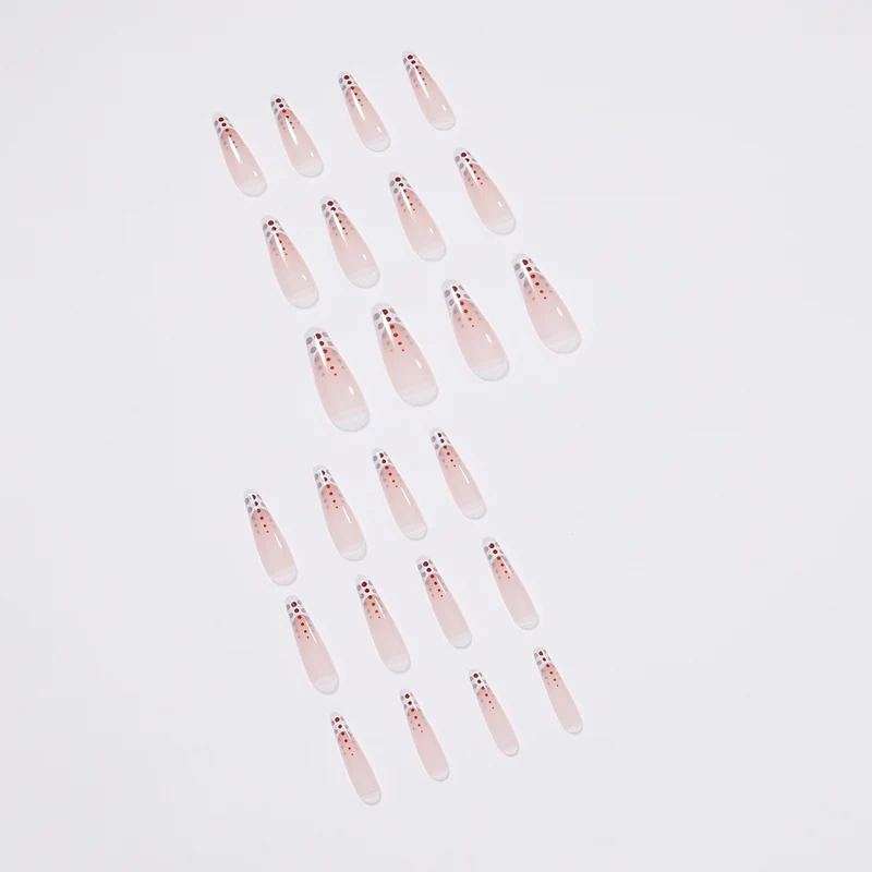 Kunstvolle Nagelverlängerungen mit eleganten Dots und schimmerndem Ombré Karnz