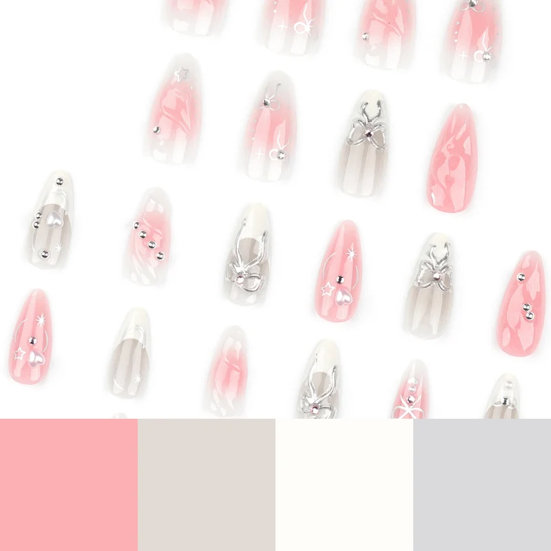 Kunstvolle Nagelspitzen mit Glitzer- und Schleifenmotiven Karnz