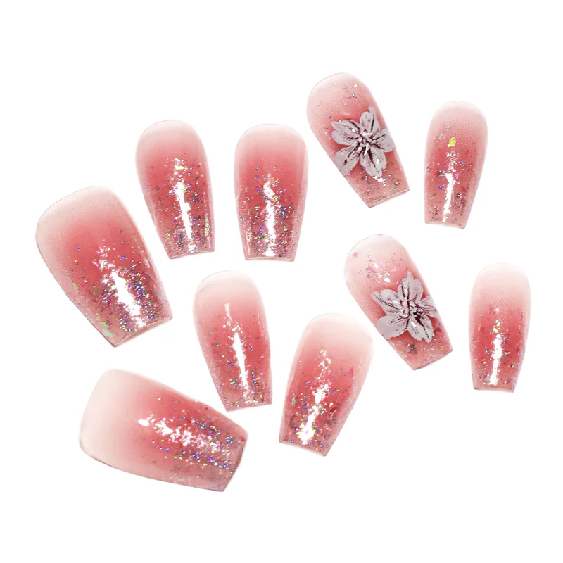 Künstliche Nagelverlängerungen mit floralem Design und Glitzerakzenten Karnz