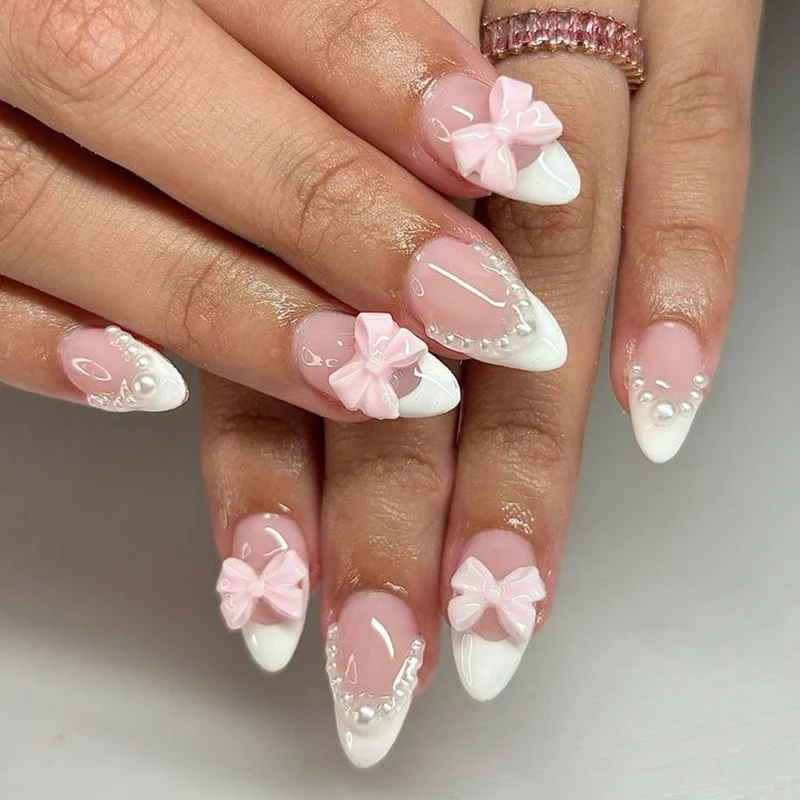 Künstliche Nagelkunst mit verspielten Punkten und Schleifen Karnz
