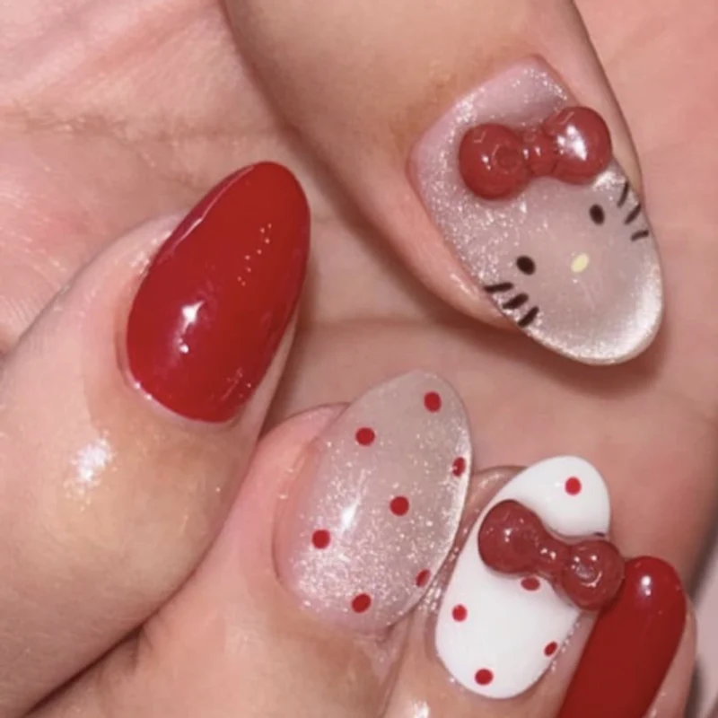 Künstliche Nagelkunst mit verspielten Punkten und Schleifen Karnz