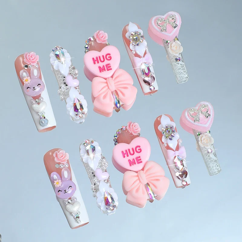 Kreatives Kunstnagelset mit verspielten Tier- und Herzmotiven Karnz