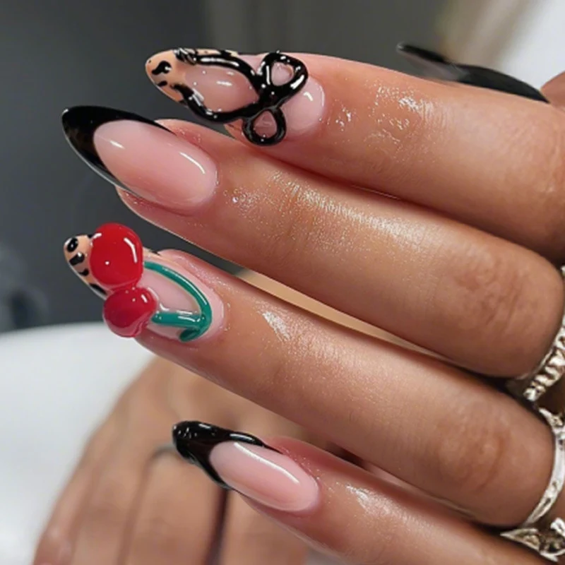 Kreatives Kunstnagelset mit stilvollen Schleifen- und Kirschmotiven Karnz