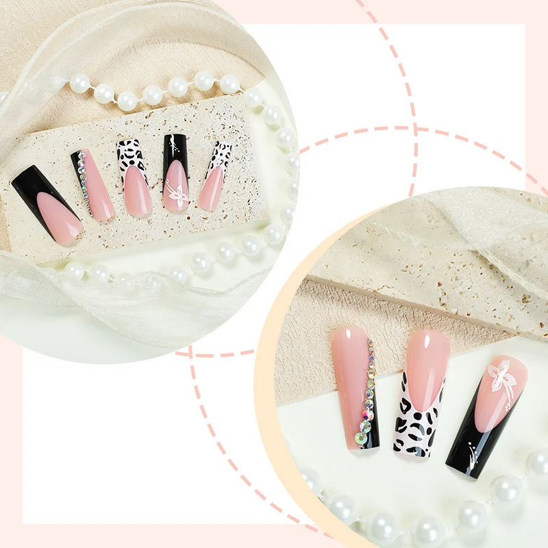 Kreatives Kunstnagelset mit elegantem schwarz-pinkem Design Karnz
