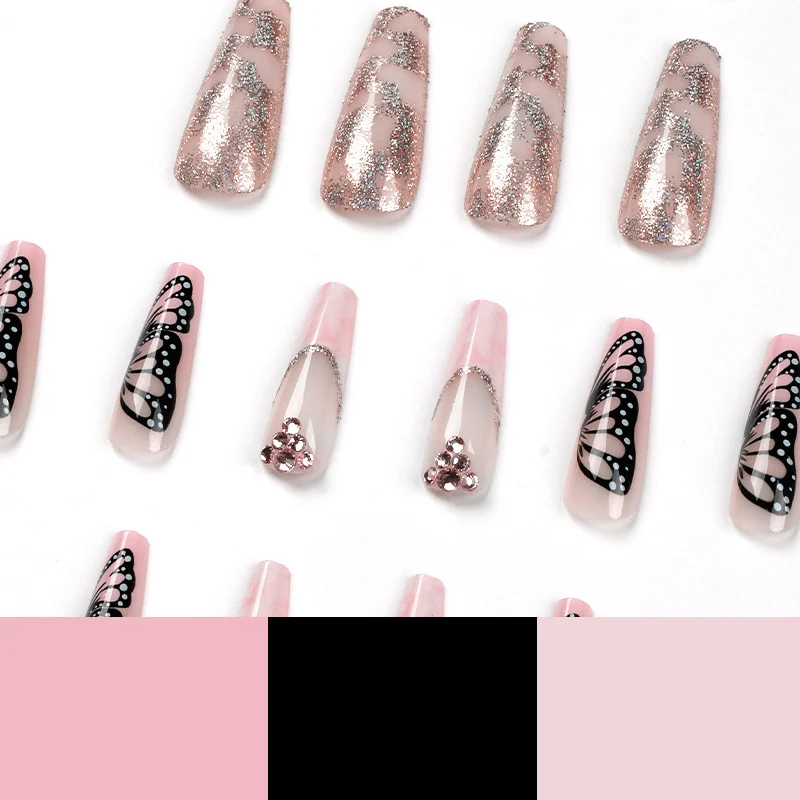 Glamouröse Nagelverlängerungen mit wunderschönen Schmetterlingsmotiven und Glitzerakzenten Karnz