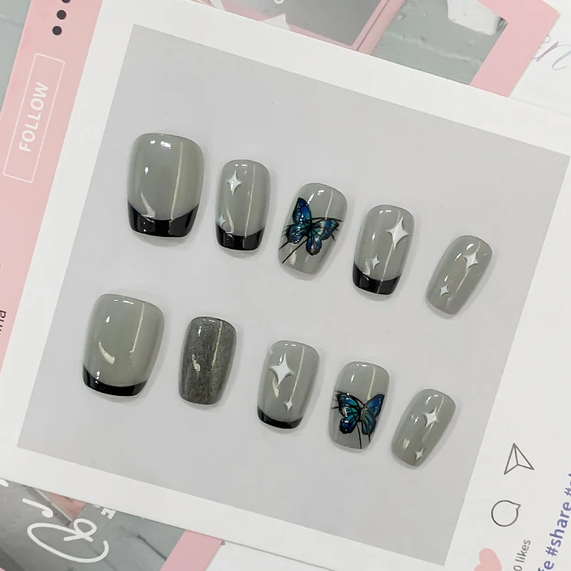 Kunstvolle Nagelspitzen mit Schmetterlings-Motiven Karnz