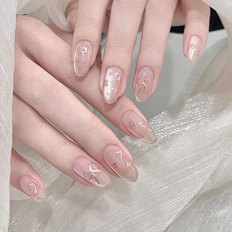 Elegante künstlerische Press-On-Nagelkunst mit Schleifen- und Herzdesigns Karnz