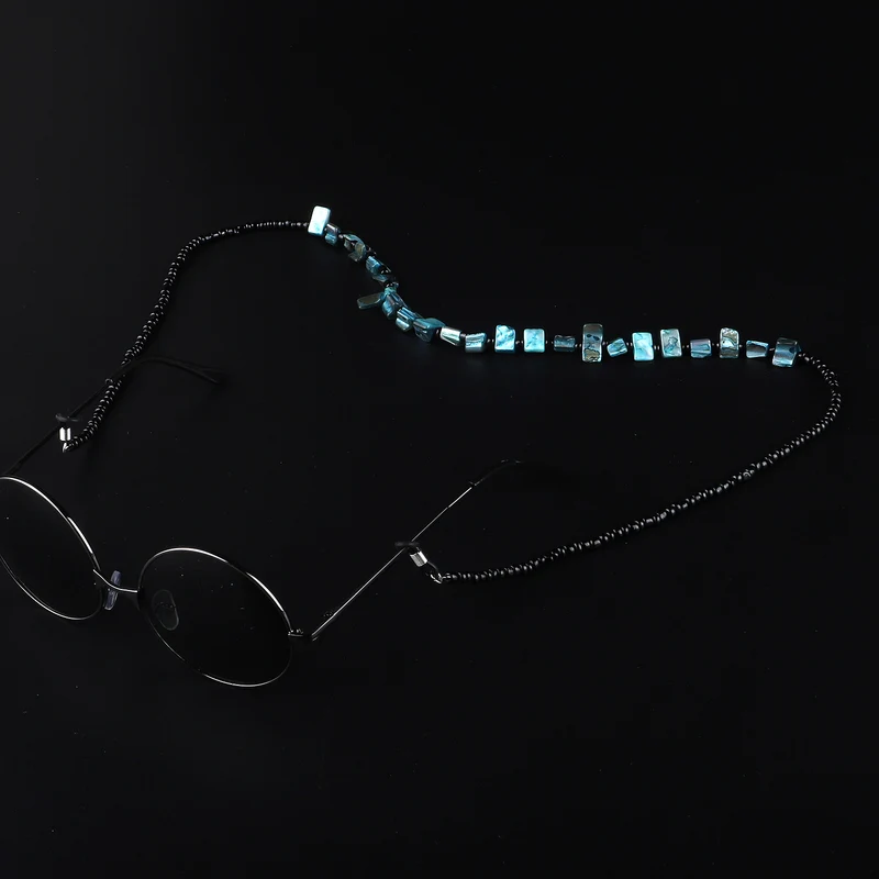 Perlenbrillenhalter mit natürlichen Muschelakzenten Karnz