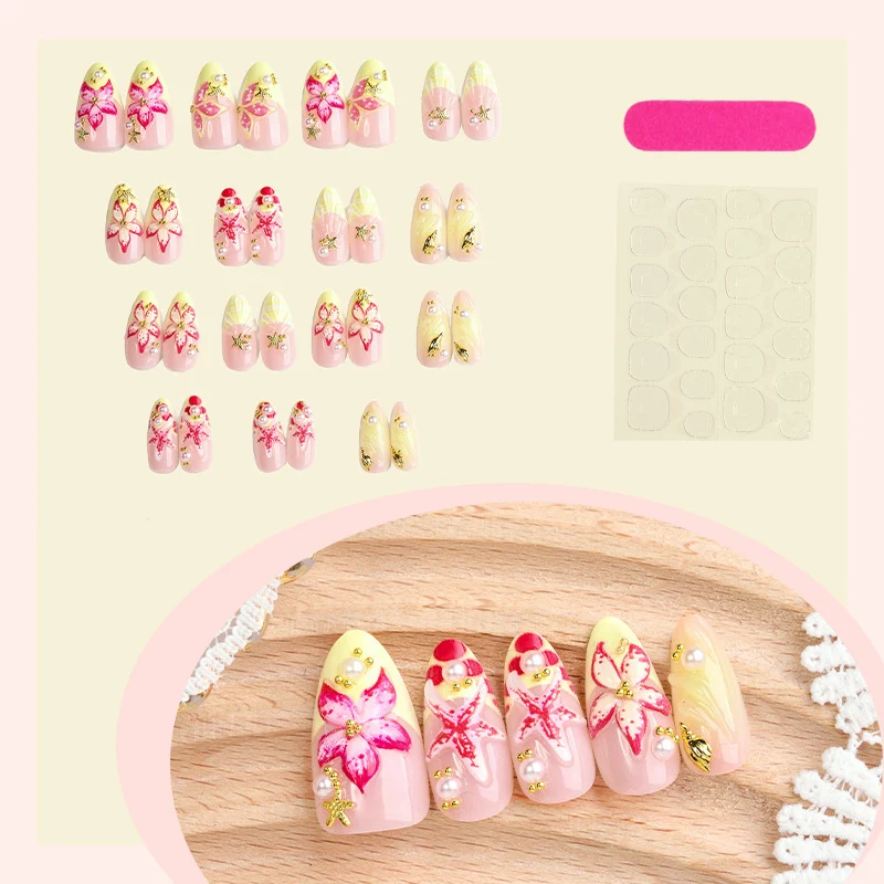 Kunstnagelset mit zarten floralen Verzierungen und Glitzerakzenten Karnz