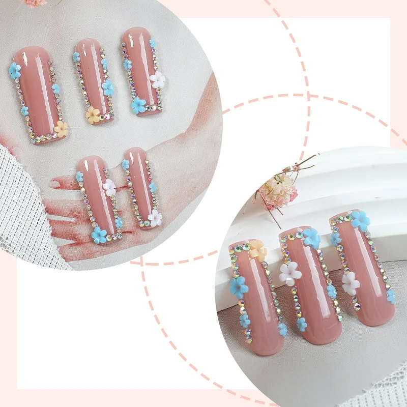 Kunstnagelset mit zarten Blumenverzierungen und Glitzerakzenten Karnz