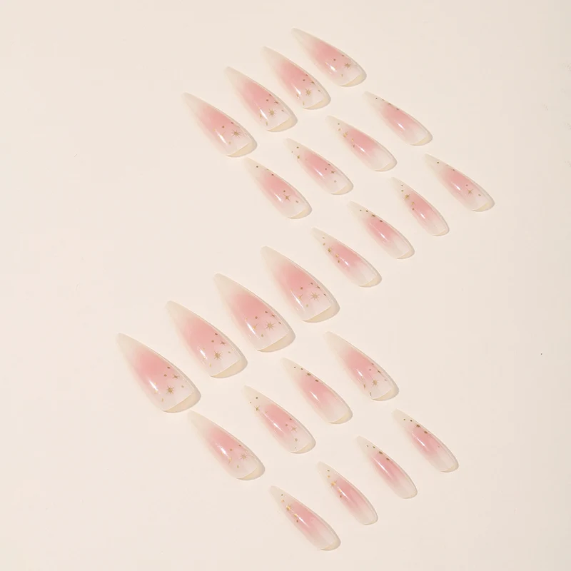Kunstnagelset mit zartem Ombre-Design und glamourösen Sternakzenten Karnz