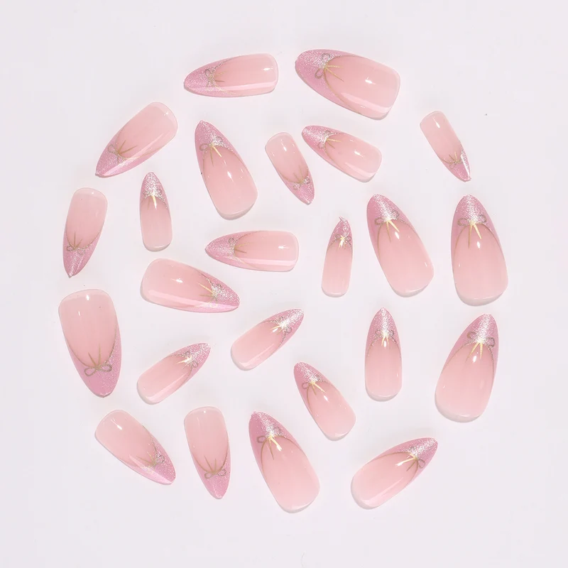Kunstnagelset mit schimmernden Spitzen und eleganten Schleifen Karnz