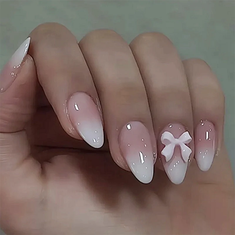 Kunstnagelset mit niedlichem Schleifen-Design Karnz