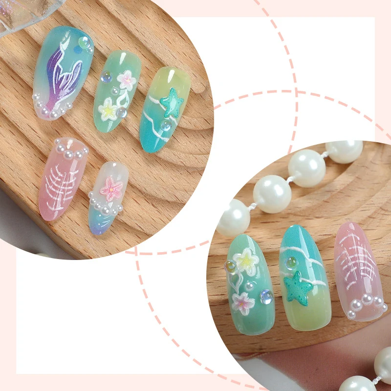 Kunstnagelset mit maritimen Motiven und floralen Akzenten Karnz