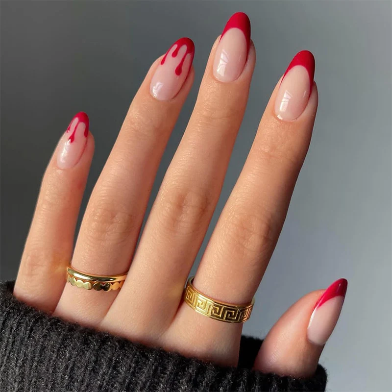 Kunstnagelset mit kreativem Rot-weißem Lackdesign Karnz