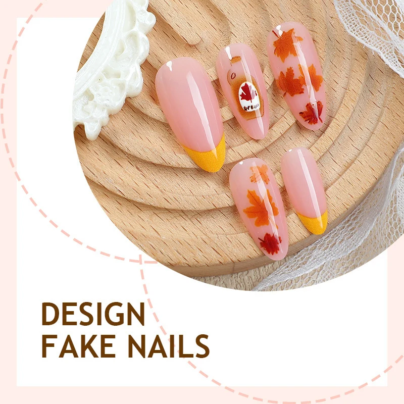 Kunstnagelset mit Herbstblatt-Dekoren und eleganten Farbverläufen Karnz