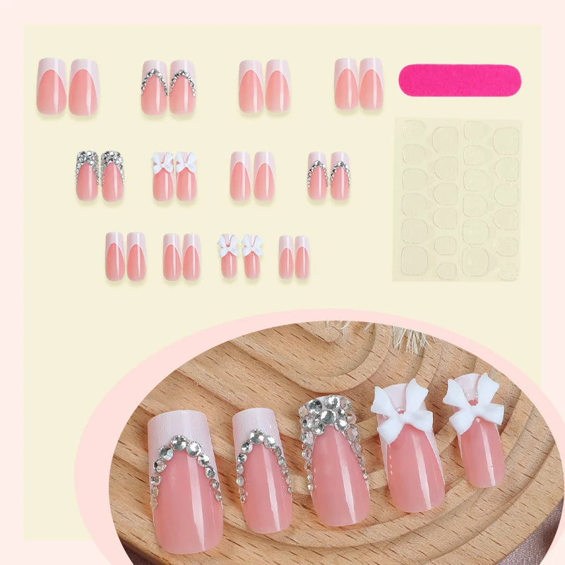 Kunstnagelset mit Glitzerakzenten und dekorativen Schleifen Karnz