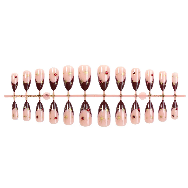 Kunstnagelset mit funkelnden Sternen- und elegantem Marmor-Effekt Karnz
