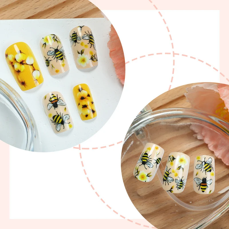 Kunstnagelset mit floralen und bienenmotiven Karnz