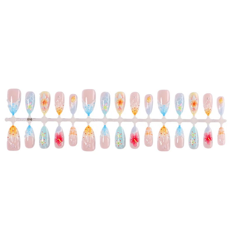 Kunstnagelset mit farbenfrohen Blumen- und maritimen Designs Karnz