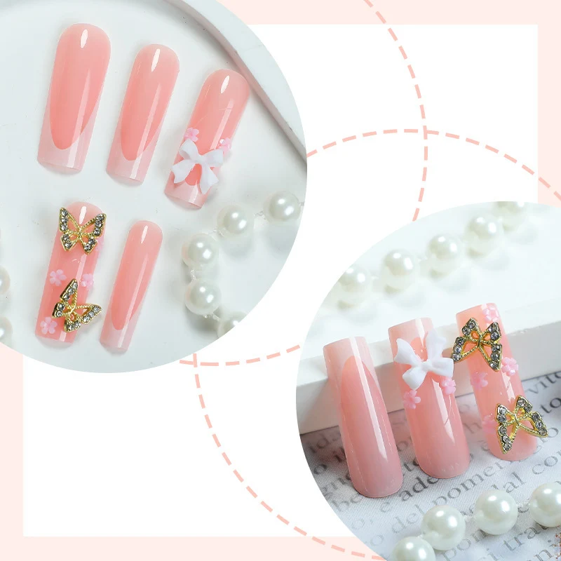 Kunstnagelset mit eleganten Schmetterlings- und Schleifenakzenten Karnz