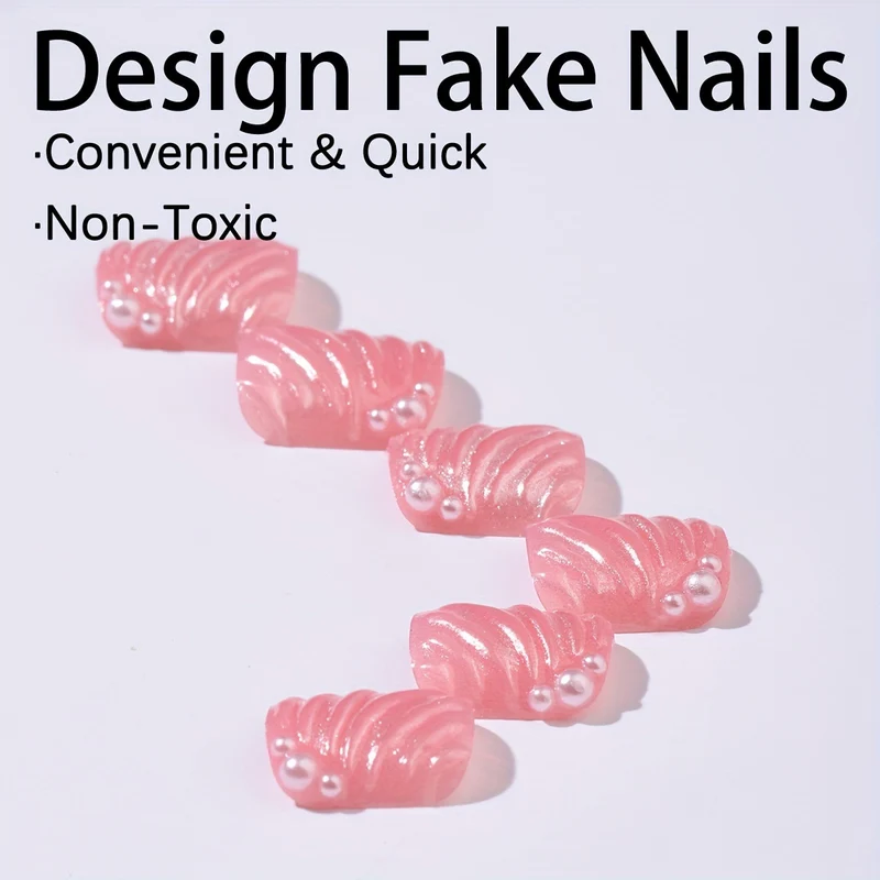 Kunstnagelset mit eleganten Muschel-Designs und Glitzerakzenten Karnz